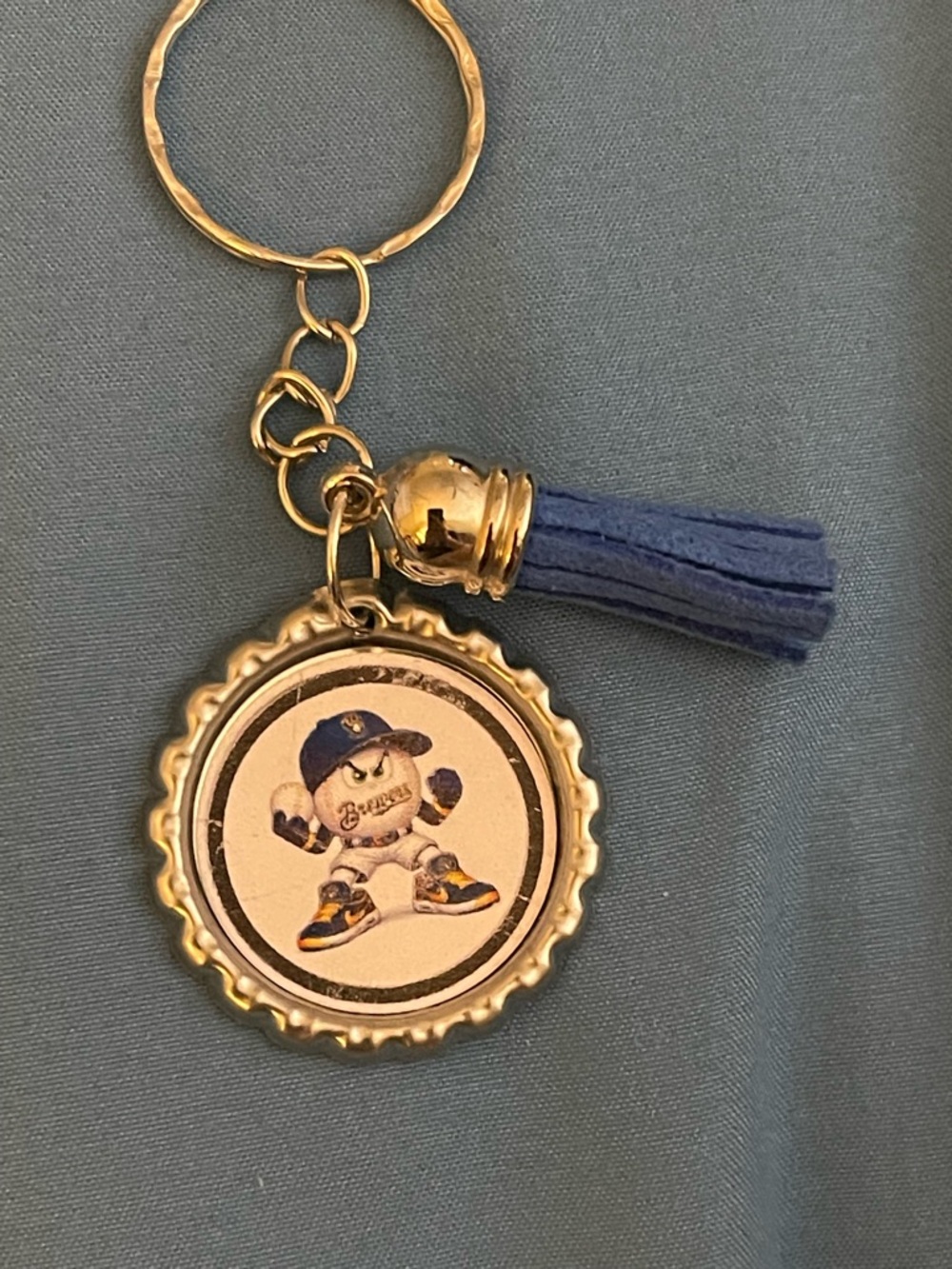 Gold Bottlecap Keychain with Blue Tassel and Baseball Mascot